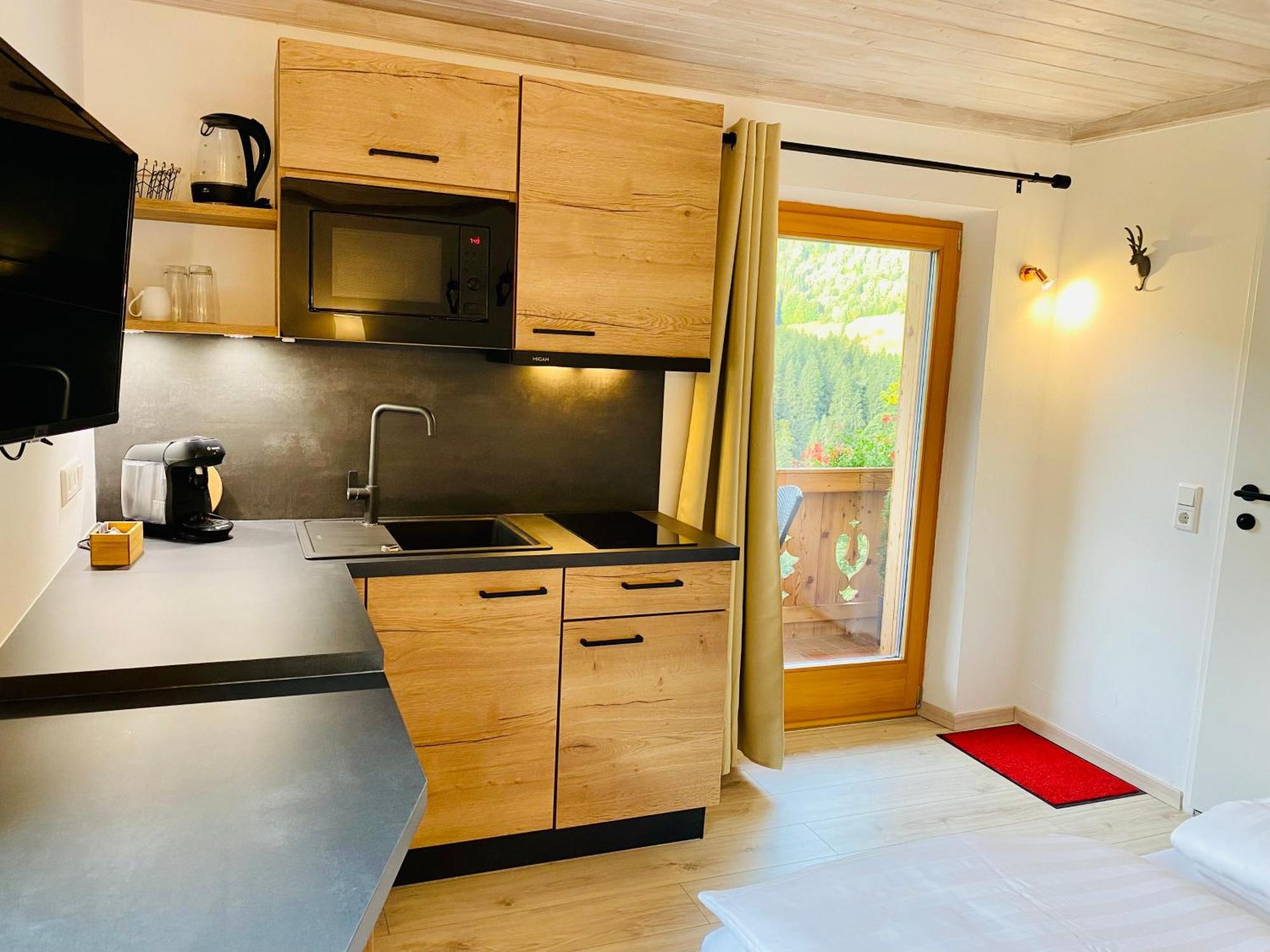 Alm Seasons Premium Chalet & Studios Зальбах-Хинтерглемм Номер фото